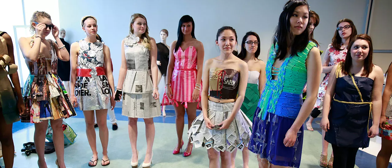 Green Dragon Fashion Show with students modeling clothes made from recycled material.