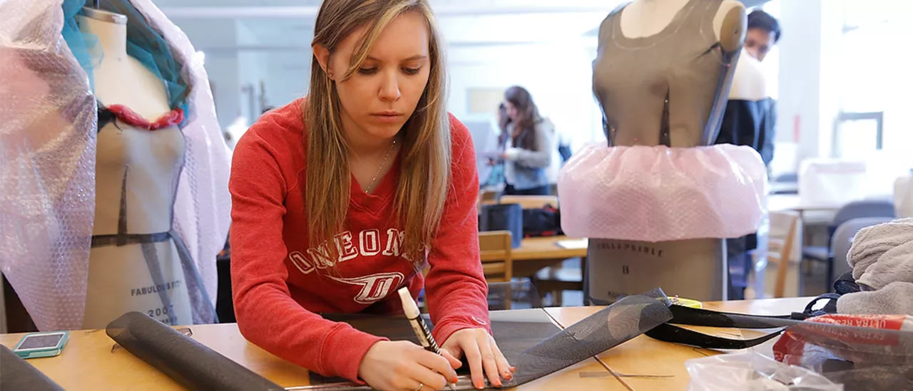 SUNY Oneonta student in a fashion design class