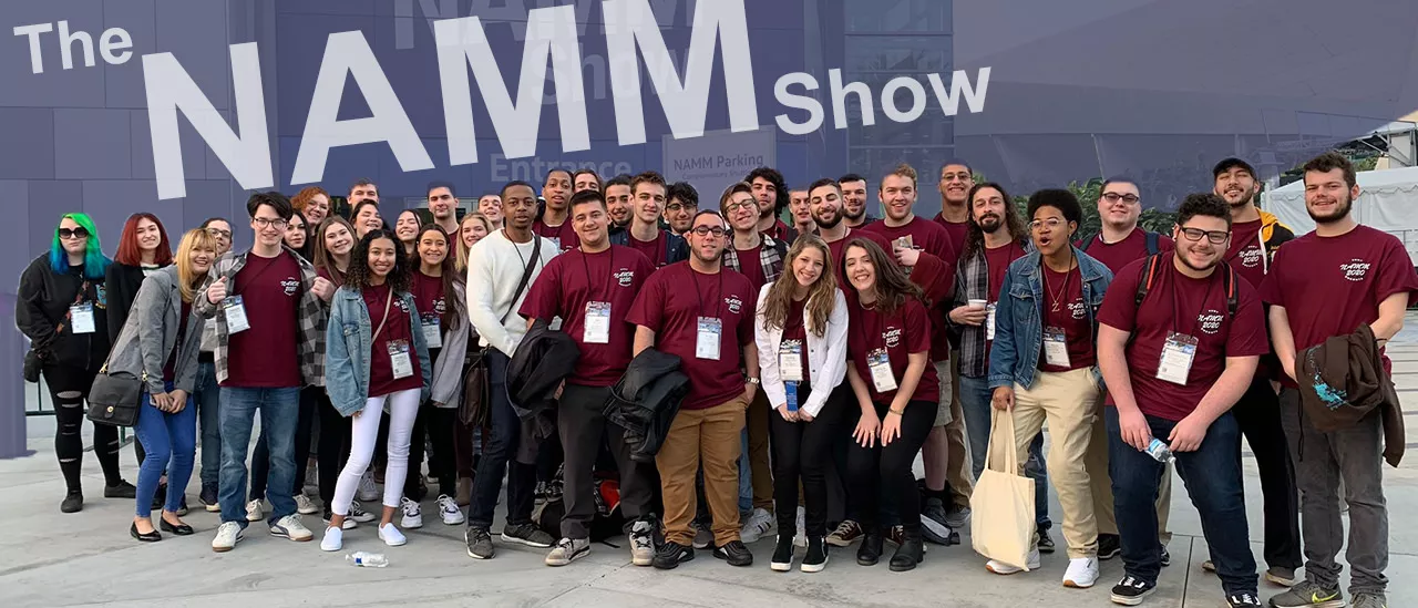 Students in front of NAMM Show sign