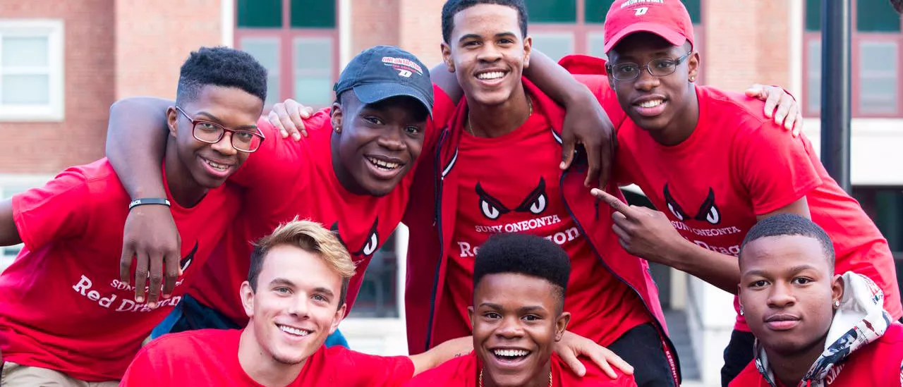 Group of students at pass through the pillars