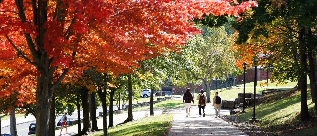 students walking on campus in fall