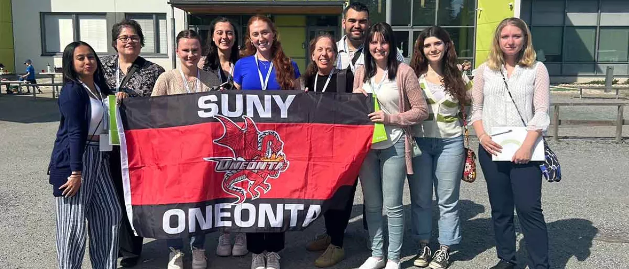 Finland trip suny oneonta students with oneonta flag