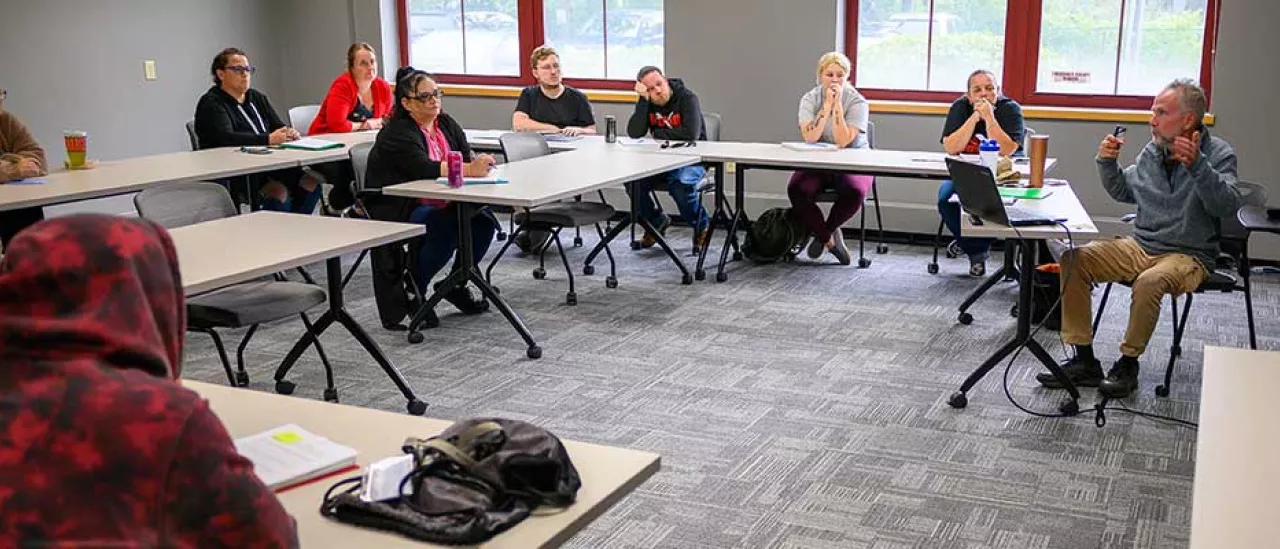 Springbrook employees in a classroom at Springbrook