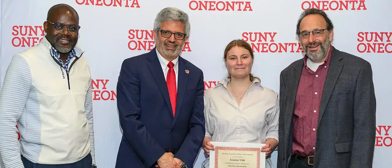Dr. Maurice Odago, President Alberto Cardelle, Gianna Vitti, and Dr. William Vining at the 2025 Academic Achievement awards ceremony