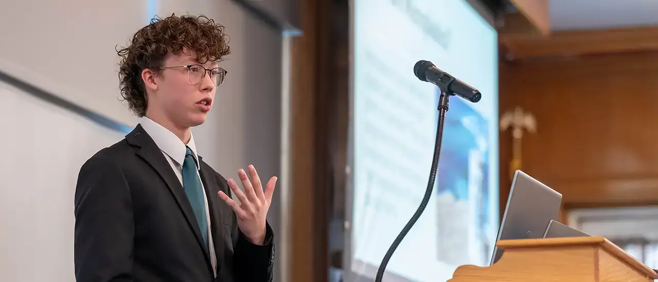 New Visions student presenting at the symposium