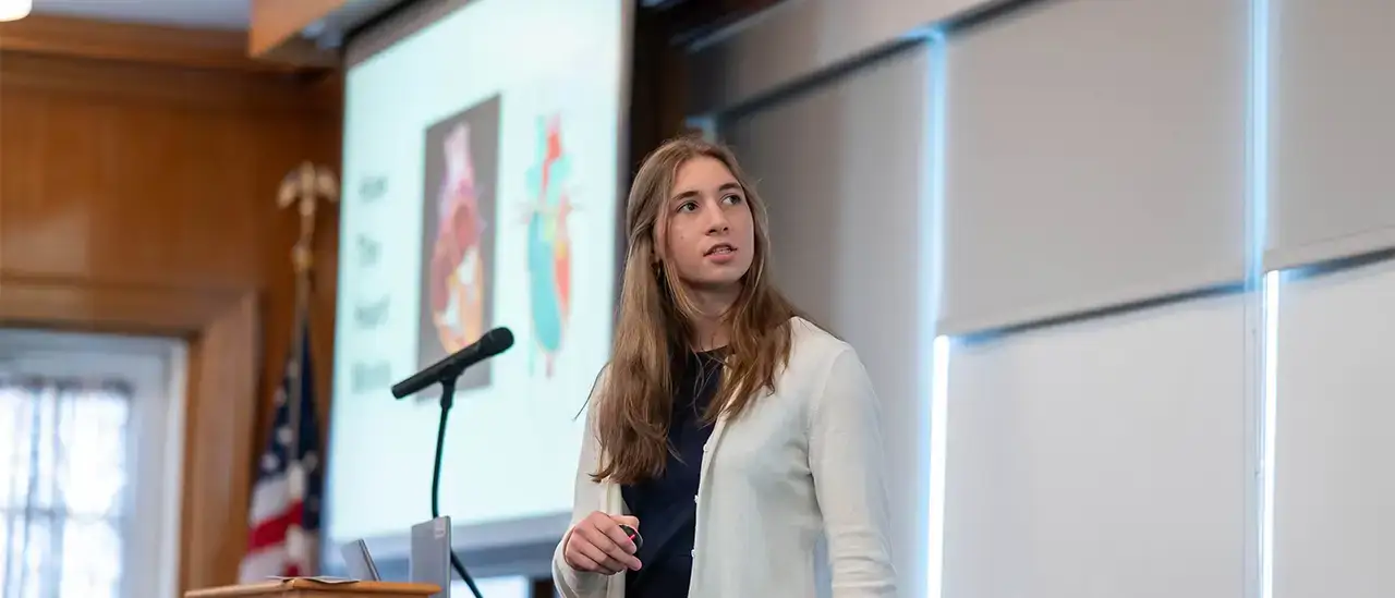 New Visions student presenting at the symposium
