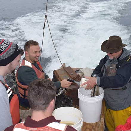 Students on a biology research vessel in coastal MainecasMaine