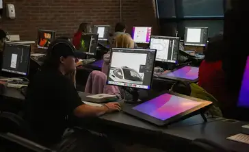 Students utilizing digital tools as part of their graphics class.