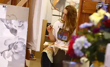 Students in a class taught by Professor Yolanda Sharpe work on the base layers of their oil paintings.