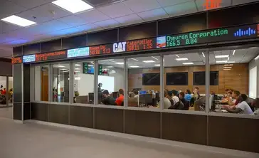Stock ticker scrolls above the windows of the Bloomberg Room.