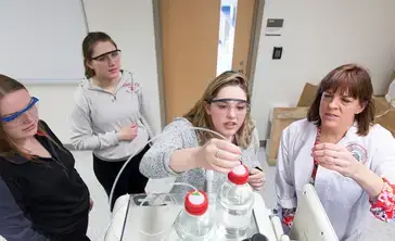 Students perform an experiment during chemistry lab