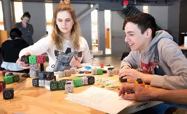 Students manipulate blocks in an activity in the Science Discovery Center