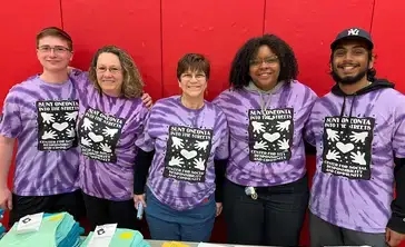 Volunteers working the SUNY Oneonta Into the Streets community event