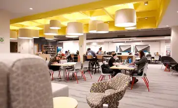 Students studying on the first floor of Milne Library