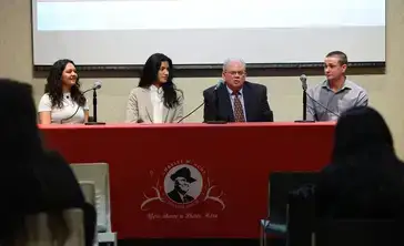 A panel of four individuals discusses political science