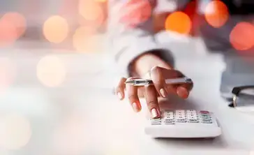 Calculator in use on a desk