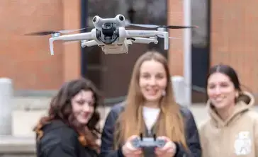 Environmental UAV Microcredential Students with Drone