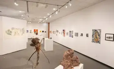 Juried Student Show artworks on display in the gallery.