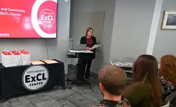 Misty Fields speaking at event at ExCL Center