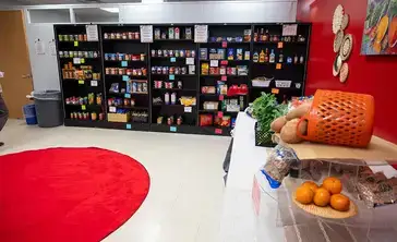 Red Dragon Food Pantry shelves stocked with items.