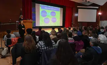 Author Robin Wall Kimmerer speaks to a crowd in the Hunt Union ballroom.