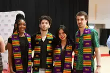 Four students donning the Kente stole during a Kente graduation 