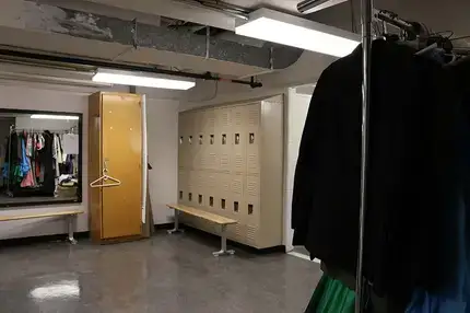Lockers along a wall in the dressing room.