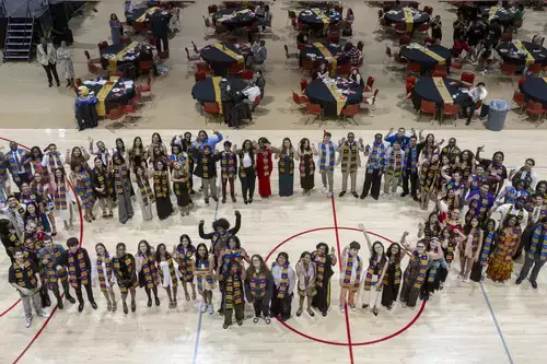 Graduates pose for a group photo at the 2025 Kente Graduation Ceremony