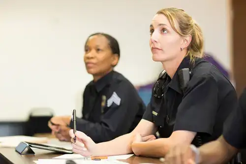 Students listen intently during a law enforcement academy class