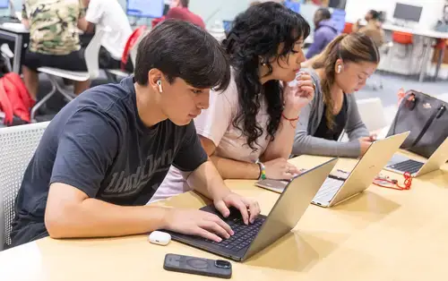 Summer Academy Students work on assignments in the library