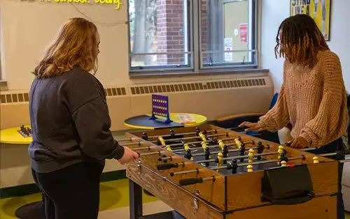 Commuter Hive Students playing table game