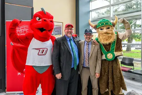 HVCC and SUNY Oneonta President's pose with mascots