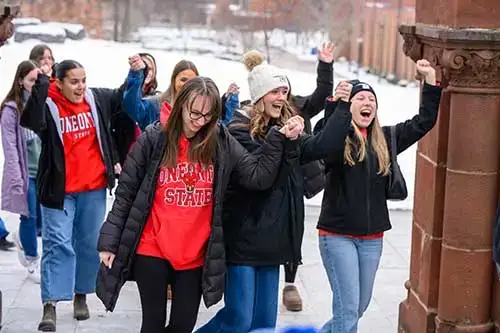 Student pass through the pillars