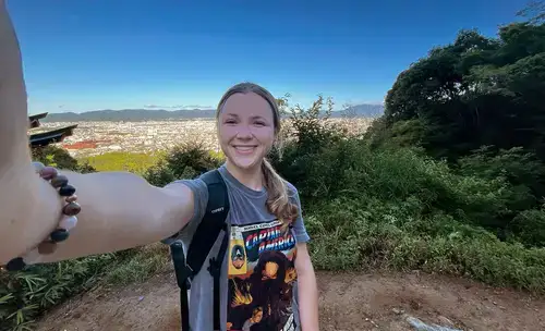 Ellie Vogl selfie on hike overlooking city