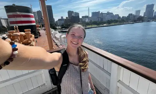 Ellie Vogl taking a selfie on a boat