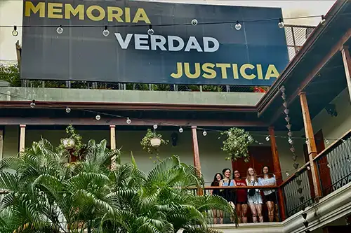 Students pose outside hotel