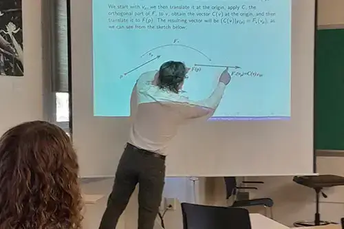 Daniel Schlagel presenting math equation