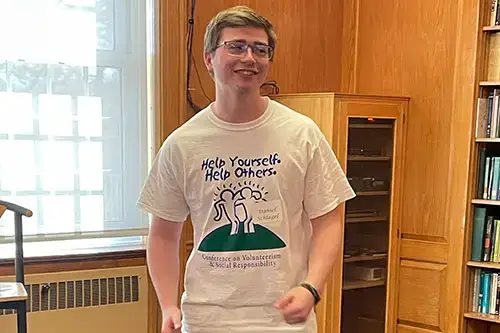 Daniel Schlagel with Volunteering Shirt
