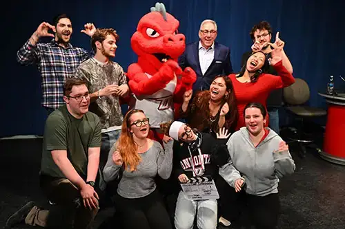 Red and Sal take a group shot with WIRE TV students