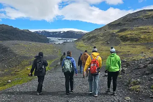 Iceland FL trip students walking down a path