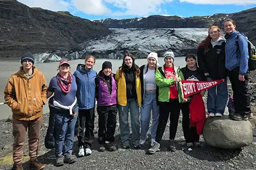 Iceland FL trip students group photo in front of lake