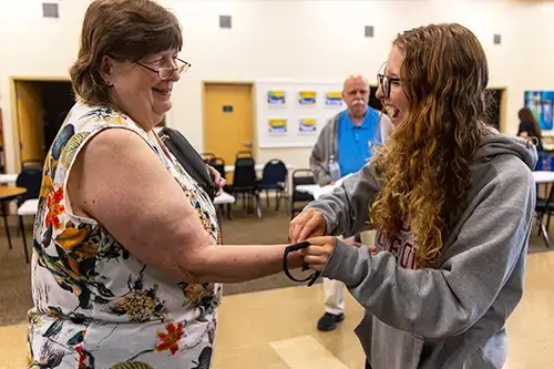 Exercise Students at The Gathering Place in east Oneonta check heart rate of resident
