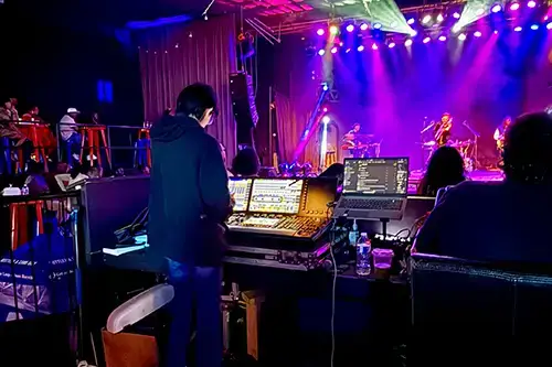 intern doing sounds at a concert