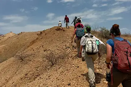 Saranna Shevalier walking to next dig site