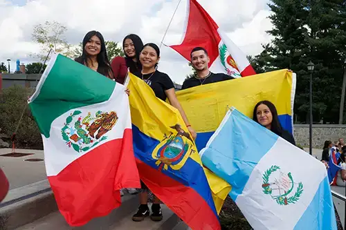 Hispanic Heritage Month Students with Flags 2026