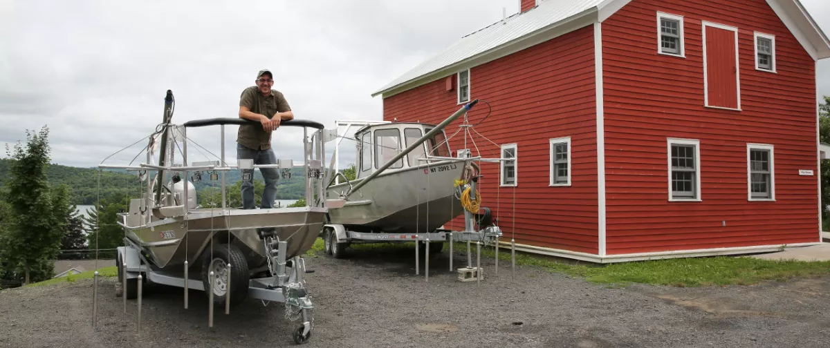 Dan Stich standing in an electrofishing boat.