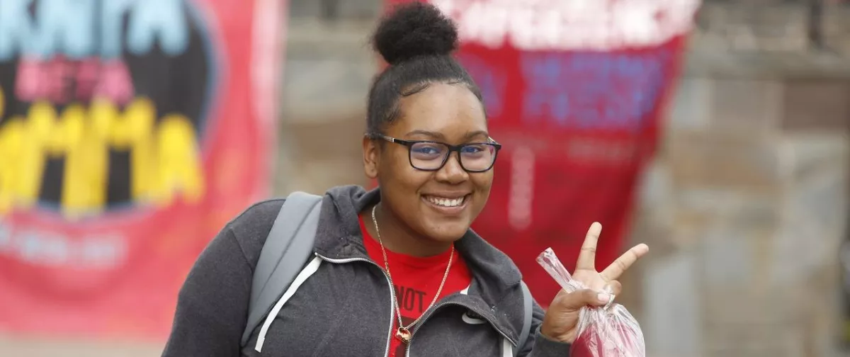 Girl giving peace sign