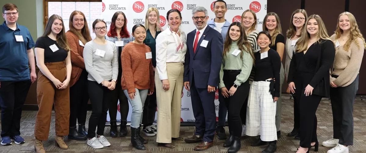 President Cardelle with scholarship recipients.