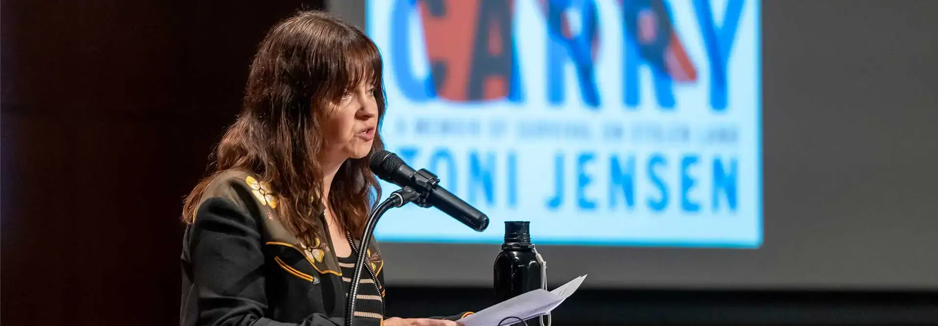 Toni Jensen speaks to audience in the Hunt Union at the 2025 Common Read.