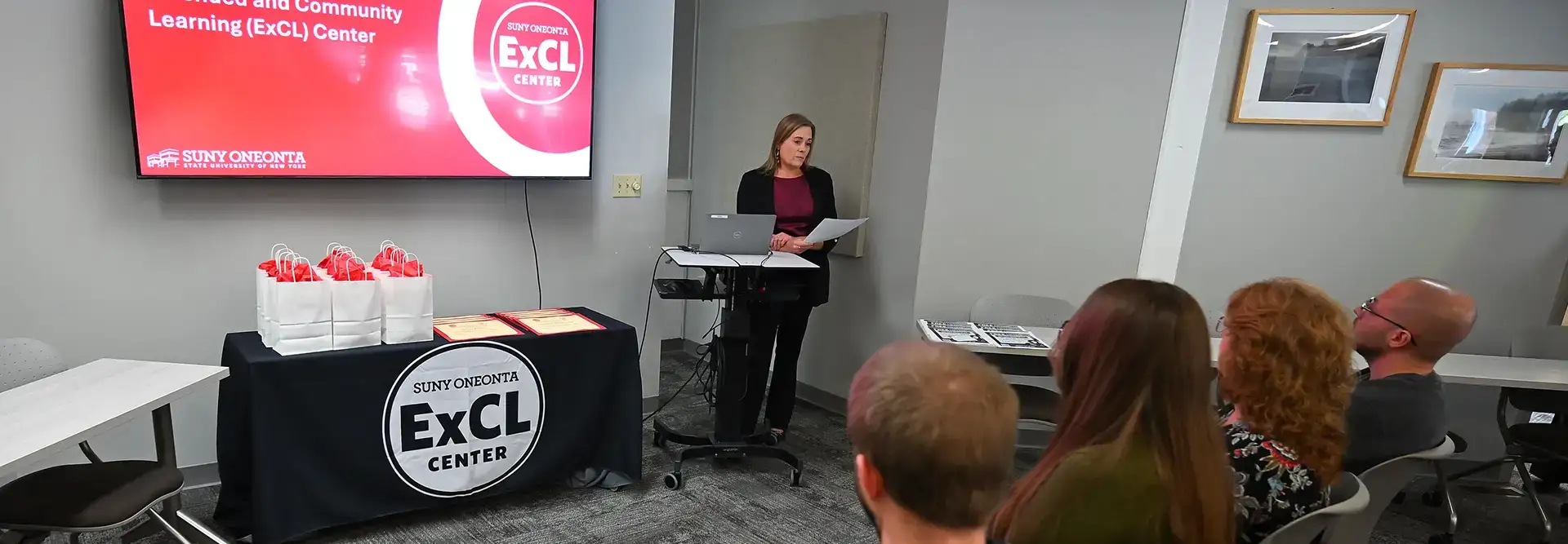 Misty Fields speaking at event at ExCL Center